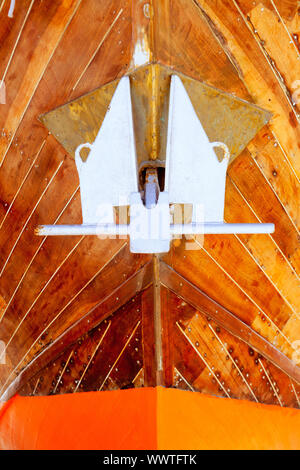 anchor detail in silver color on a wooden hull boat Stock 